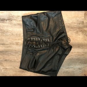 Black faux leather shorts.